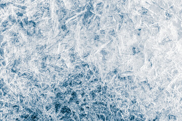 Ice texture crystal, blue tones background. The textured cold frosty surface of the ice.