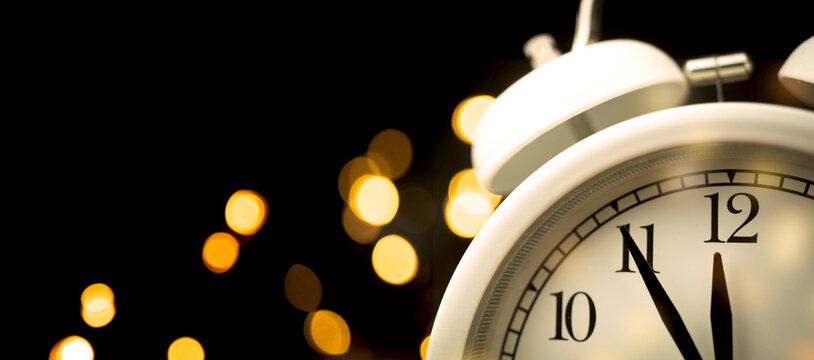 Five minutes to midnight. Midnight countdown to new year. Abstract firework sparks on dark sky background, copy space - Powered by Adobe