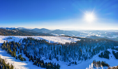 Picturesque winter panorama of mountain hills