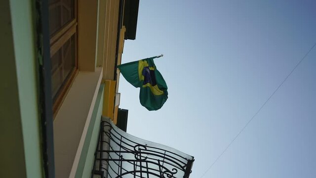 Official Federative Republic Brazil national flag waving by wind at building. Country sign and symbol concept.