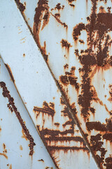 Structures of rust on a white painted metall surface