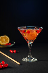 Drink with red viburnum, lemon and ice. Refreshing drink, non-alcoholic cocktail.