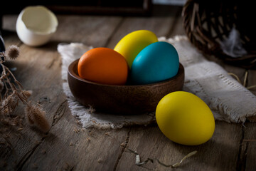 Painted Easter eggs on a rustic table