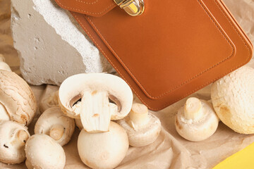 brown bag from eco leather and mushrooms on a yellow background, mycelium leather concept