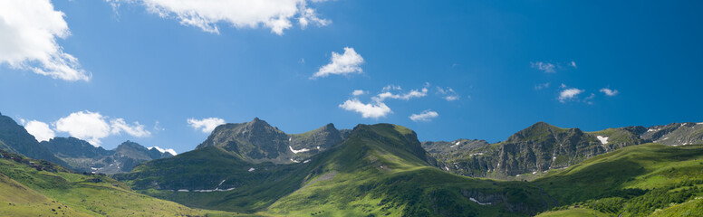 Fototapeta premium High mountains and plateaus in late spring. Snowfall in the mountains.
