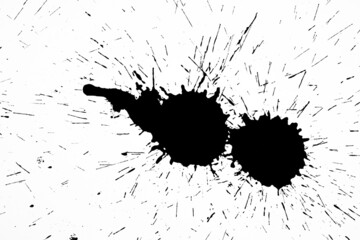 Black blot on a white background. Spots of black ink on a piece of paper.