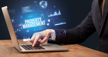 Businessman working on laptop, business concept