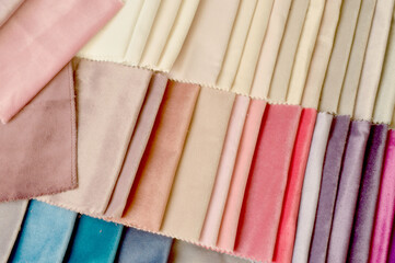 Multicolored samples of upholstery fabric for furniture, background