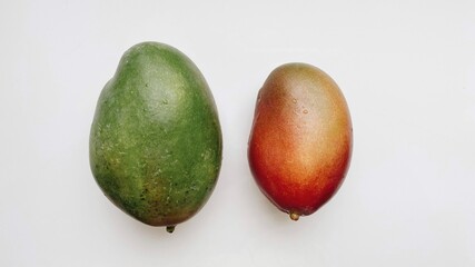 red and green ripe mango on white background