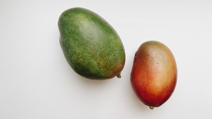 red and green ripe mango on white background