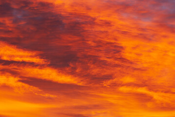 A beautiful fascinated red like fire cloudscape before sunrise in autumn