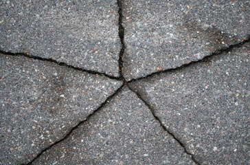 Obraz premium Cracked asphalt texture. View from above. Close-up
