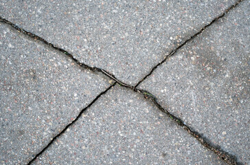 Cracked asphalt texture. View from above. Close-up