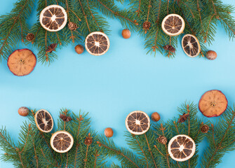 Christmas background with branches of fir, empty copy space, blue backdrop