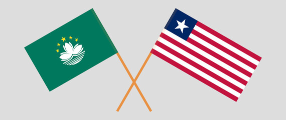 Obraz premium Crossed flags of Macau and Liberia. Official colors. Correct proportion