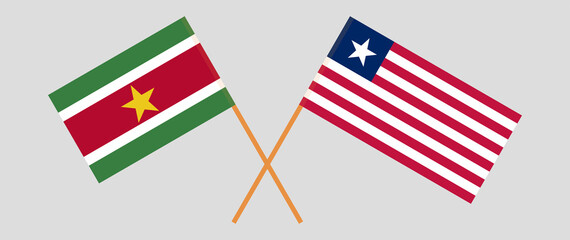 Crossed flags of Suriname and Liberia. Official colors. Correct proportion
