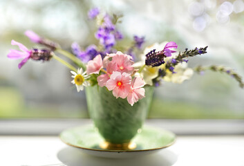 flowers in a tea cup
