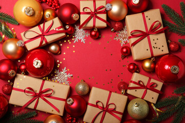 Christmas decorations and gifts on a colored background top view