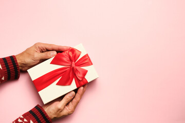 picture from above of a gift with red bow