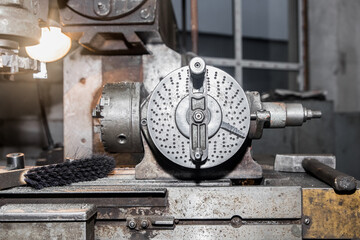 Part of the old equipment for metalworking milling machine close-up in the shop of the industrial plant