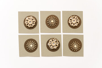 background pattern with paper circles and wooden floral shapes