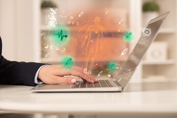 Doctor working on laptop with healthcare concept