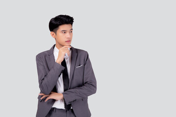 Obraz na płótnie Canvas Portrait young asian business man in suit with smart thinking idea isolated on white background, businessman standing and planning for success, handsome manager or executive, emotion and expression.