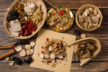 traditional Chinese medicine herbal on wood background