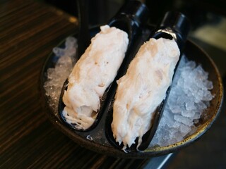 Fresh fish paste in a bowl filled with ice cubes