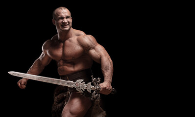 Ferocious muscular ancient warrior barbarian with fantasy sword on black background - 466227568