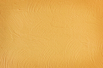 Cement yellow wall plaster and piant rough style, Decorative plaster effect on wall texture abstract background