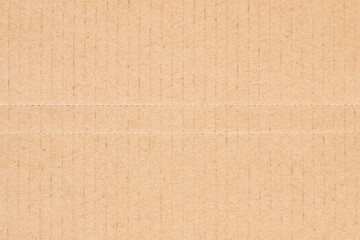 Fototapeta na wymiar Flat brown cardboard background texture with perforated lines that will help the box fold texture background