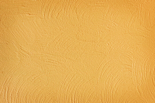 Cement yellow wall plaster and piant rough style, Decorative plaster effect on wall texture abstract background
