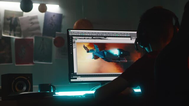 Teenager creating 3D cartoon on computer