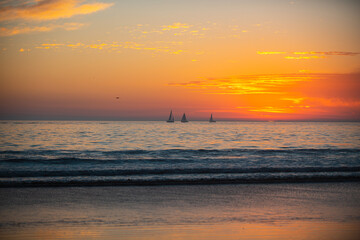 Ocean sunset on sky background with colorful clouds. Calm sea with sunrise sky.