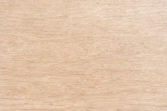 Light brown wood there are stains on the surface for background texture and copy space