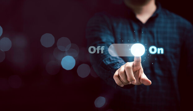 Businessman touching to virtual toggle switch button for change from off to on.