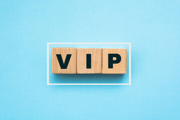 VIP Very Important Person text on wooden cubes on blue. Business concept.