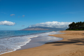 Hawaii beach. Sea background, nature of tropical summer beach with rays of sun light. Sand beach, sea water with copy space, summer vacation concept.