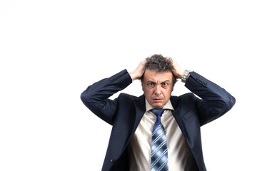 An unshaven middle-aged man in a business suit with disheveled hair and an emotional face looks straight ahead 