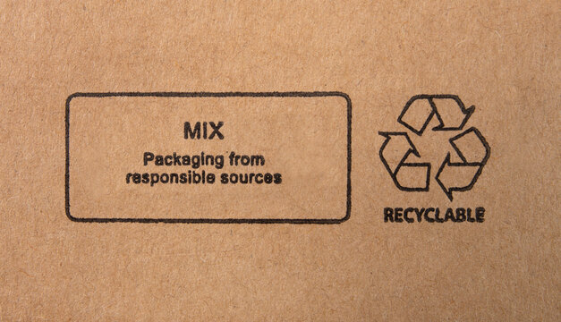 Close up of recyclable icon printed on cardboard box.