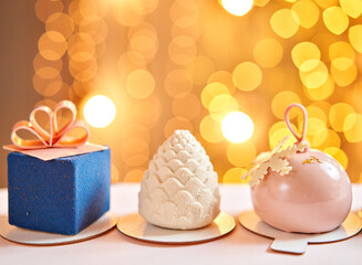 Merry Christmas card. Variety of sweet delicious cakes. Fir branches on a gray background. Merry Christmas card. New year mood