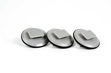 Plastic gray clips for car door sill fastening. Close up. Isolated on white background