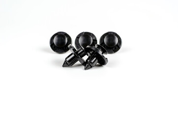 Plastic Black Clips For The Car. Close Up. Isolated On A White Background