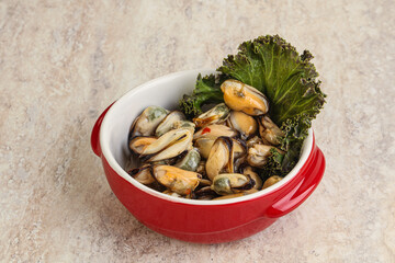 Tasty marinated mussels in the bowl