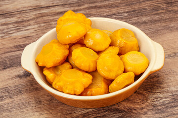 Marinated yellow patisson in the bowl