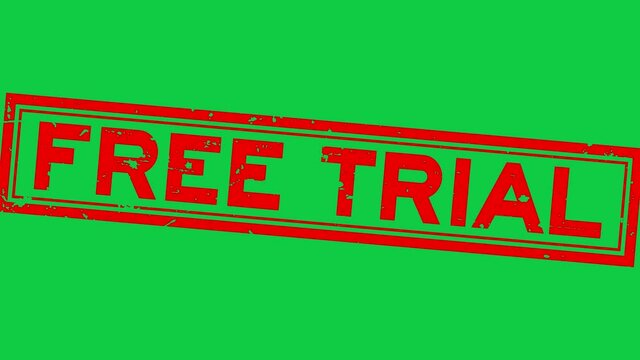 Grunge red free trial word square rubber seal stamp zoom on green background