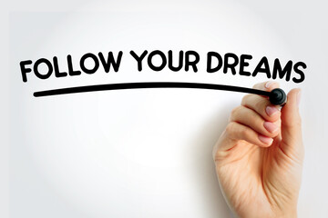 FOLLOW YOUR DREAMS underlined text with marker, concept background