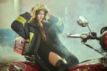 Naklejka na ściany i meble beautiful woman firefighter