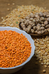 Various cereals on a wooden background. The concept of wholesome food. Vegetarian food